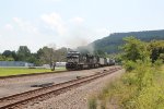 NS 7717 and 9942 make some smoke as they lead a freight